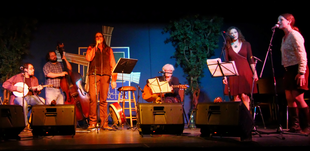 The Slight Exaggerations in full ensemble on a decorated stage